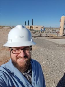 A selfie of me in my safety gear at the Devon well site.
